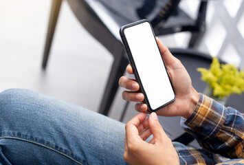 cell phone blank white screen mockup.hand holding texting using mobile on desk at office.background empty space for advertise.work people contact marketing business,technology