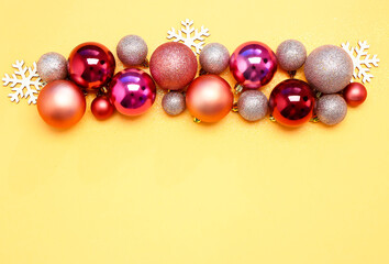 Composition with beautiful Christmas balls on color background