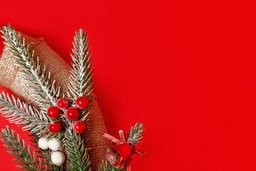 Christmas or New Year composition wreath made of Xmas decorations and fir tree branches and gifts with copy space for text on card