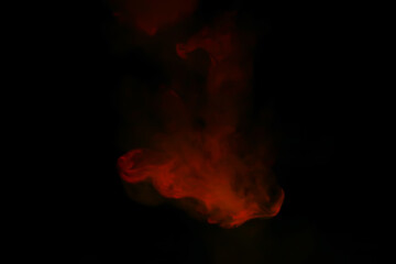 Red smoke over black studio background. Red steam on a black background. Copy space.