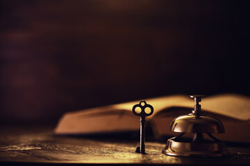Book on a wooden table background with copy space. Historical atmosphere. Vintage english style. Evidence searching concept. Empty place for text.