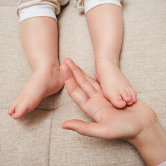 Deformed toes on the foot of the toddler baby, congenital curvature. Kid aged one year and three...