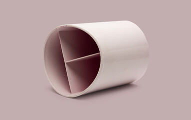 Old used pen and pencil organizing cup lying on isolated background