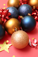 Heap of beautiful Christmas decorations on red background, closeup