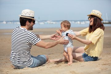 happy young family have fun on beach together