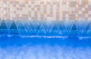 Abstract background with Hotel swimming pool with sunny reflections.