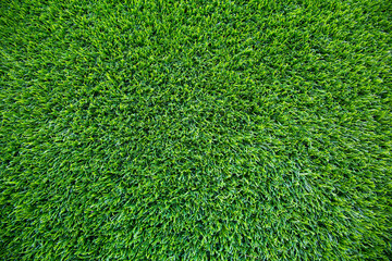 Top view of artificial green grass texture for background. Abstract concept design picture backdrop...
