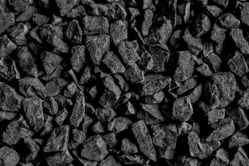 Natural black coals for background design. Industrial coals. Volcanic rock energy on earth.