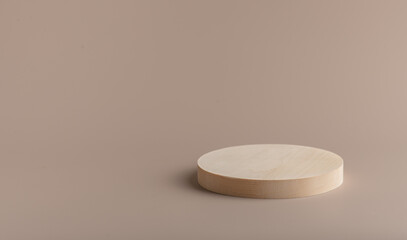 wooden podium on a beige background, mockup for presentation and design