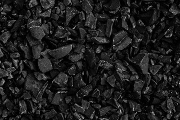 Natural black coals for background design. Industrial coals. Volcanic rock energy on earth.