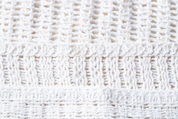 White crochet texture close up. Crochet mesh fabric for clothing