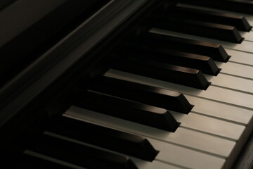 Naklejka premium Piano, keyboard close up instrument playing music, practing and celebrate in dark room