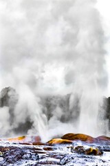 a geyser is erupting with a big fountain of water splashing into the air