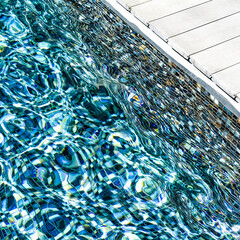 On a swimming pool's edge