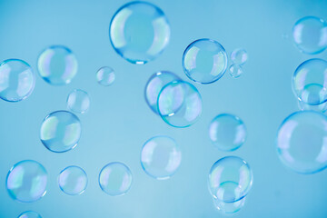 Abstract blue soap bubbles background. Blue soap bubbles wallpaper.