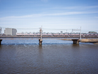 train bridge on the river and blue sky in katsushika ward