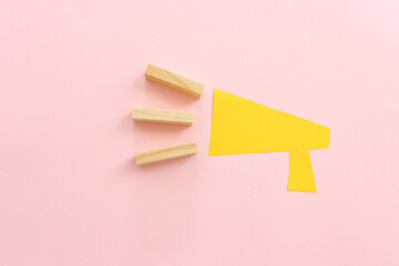 Concept image of megaphone for announcement or attention, over pastel background
