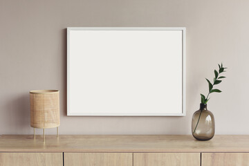 Blank picture frame mockup on gray wall. White living room design. View of modern scandinavian...