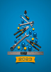 A symbolic Christmas tree made of construction tools on a blue background. 3D render illustration.