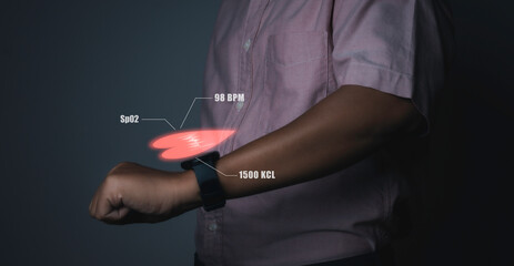 Man using smart watch technology checking heart rate.