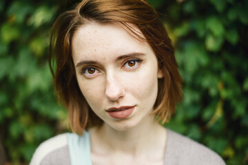 Portrait of beautiful sensual woman with freckles.