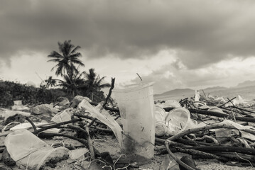 Trash or junk on the beach with warm filter . Plastic cup in the pollution area ,Chumphon Gulf of...
