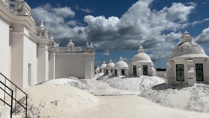 Cathedral of Leon, Nicaragua. The rooftop of a white-colored cathedral. Pan shot over the roof of a white church. Stunning clouds and white color building. Central American colonial-style cathedral. 