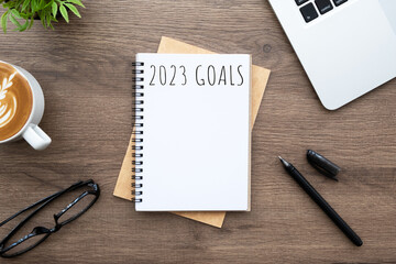 Notebook with 2023 goals text on it to apply new year resolutions and plan.