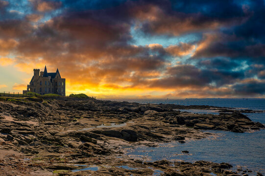 France, Brittany, Quiberon, Dramatic clouds over Chateau Turpault at dusk