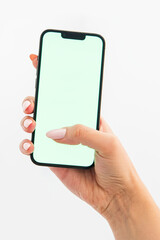 hand holding green screen phone