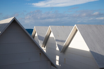 white  empty beach huts in Procida