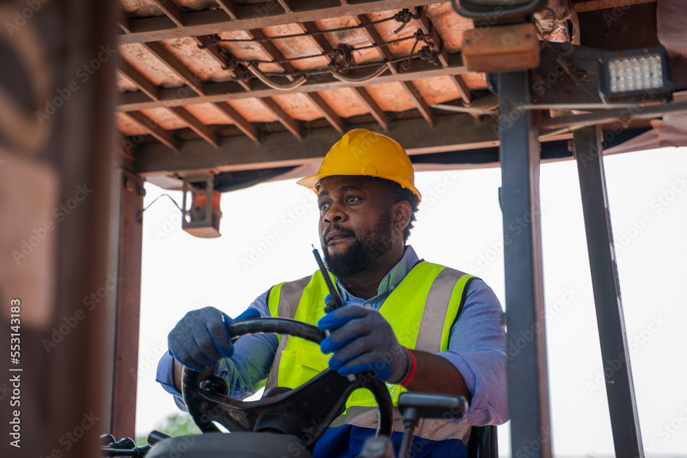 Poster foreman working at container stock yard with drive a loader forklift steering wheel control for tran
