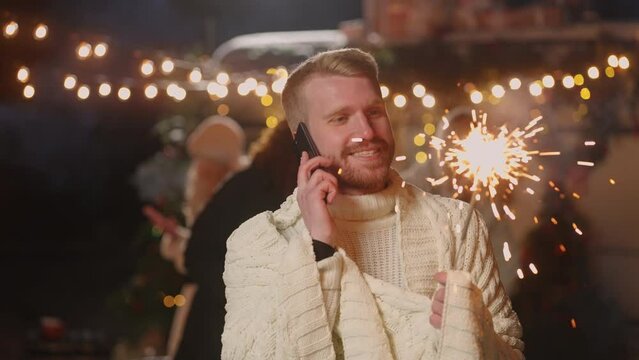 man is calling by phone to congratulate friends and colleagues with Christmas and New year holiday