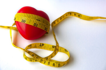 Heart shape wrapped with measuring tap with customizable space for text. Copy space and weight loss concept