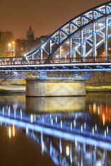 KRAKOW, POLAND - NOVEMBER 15, 2022: Jozef Pilsudski bridge over Wisla river, Krakow, Poland. - obrazy, fototapety, plakaty