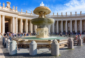 Fountain on St. Peter's square and St. Peter's basilica in Vatican