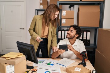 Man and woman business workers doing  accounting at office