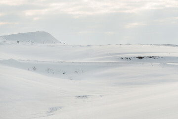 Naklejka na ściany i meble Winter landscape, hills covered in white snow