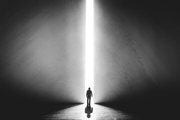 The silhouette of a man walking towards a bright light in the opened huge wall. A light in the end of a tunnel. The concept of success, freedom of choice, open mind, meditation. - obrazy, fototapety, plakaty