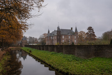 Fototapeta na wymiar The outside walls of the historic building Zuylen castle or slot Zuylen as it is called in Dutch on a cold winter day. includes the bridge, keep, gate moat and main building