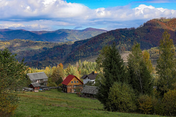 Picturesque view of houses and trees in mountains