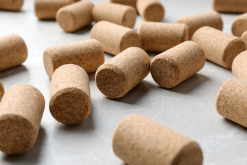 Wine bottle corks on light grey marble table, closeup