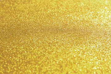 Beautiful golden shiny glitter as background, closeup