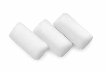 Three pieces of chewing gum on white background, top view
