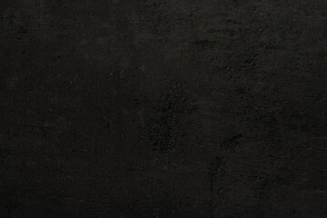 Texture of black stone surface as background, closeup