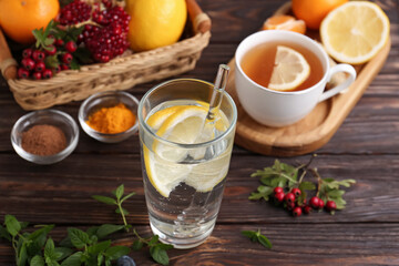 Delicious immunity boosting drink and ingredients on wooden table