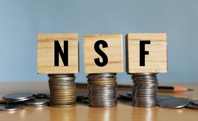 NSF concept, Non Sufficient Funds concept on wooden blocks. 