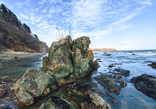 Green mineral rock on the coast
