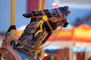 carousel. details from a carousel with horses. photo during the day.
