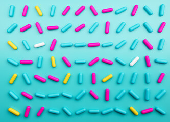 Colorful sprinkles on a blue background, top view 3d illustration